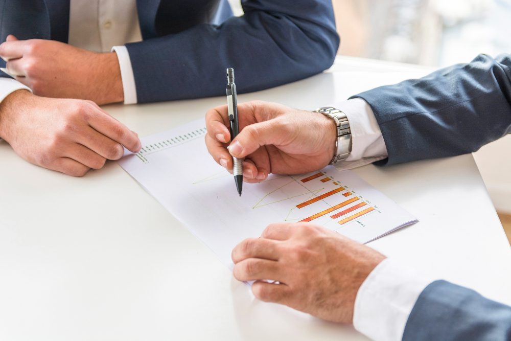 A person reviewing a risk assessment chart